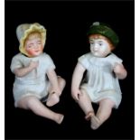 A Victorian Bisque porcelain nodder in the form of a baby girl, and another similar in the form of a