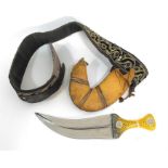 An Arabian Jambiya in scabbard with belt.