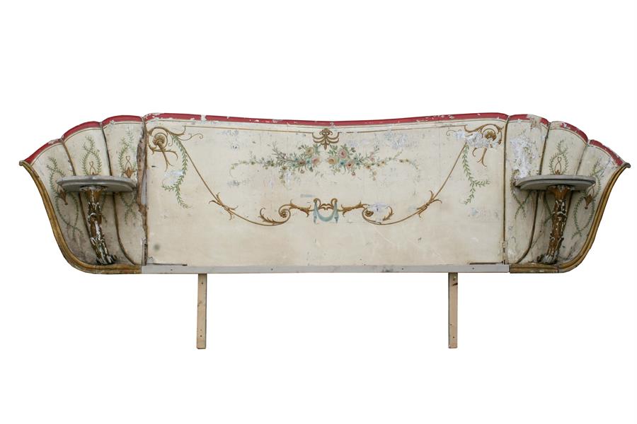 An Italian painted wooden headboard, decorated with flowers & swags, 295cms wide.