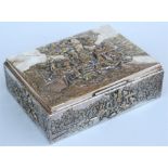 A silver plated table top cigarette box decorated in relief with figures, 18cm x 14cm.