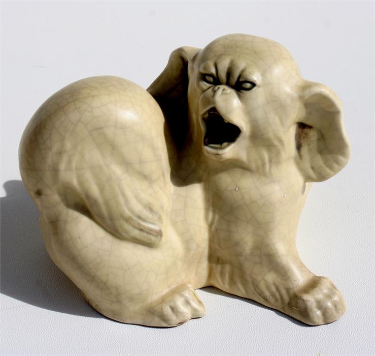 A Royal Copenhagen pottery figure of a Pekingese dog by Knud Kyhn in cream crackle glaze 12cm high