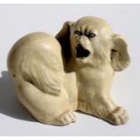 A Royal Copenhagen pottery figure of a Pekingese dog by Knud Kyhn in cream crackle glaze 12cm high