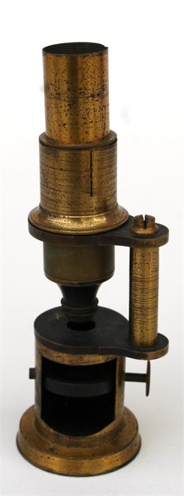 A lacquered brass students microscope (a/f).)