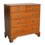 An early 19th century oak chest of two short & three long graduated drawers, on bracket feet, 106cms
