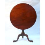 A 19th century mahogany tilt-top occasional table, with turned column on tripod base, 78cms.