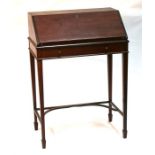 A mahogany ladies bureau, with fall flap enclosing a sectioned interior, with single frieze