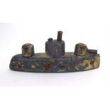 An unusual lead WW1 Trench Art model of a submarine or battleship, 10cms long by 5cms high.