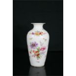 A Meissen style vase, decorated with flowers, 26cm high.