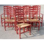 A set of eight painted ladder back chairs with rush seats (possibly Chalon) (8)
