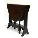 An oak narrow gateleg table, on turned supports, 75cms. wide.