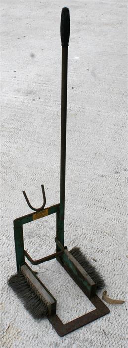 A metal Scrayjak boot jack and scraper, 113cm high.