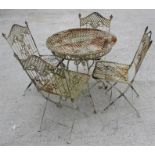 A circular metal painted garden table and four matching folding chairs.