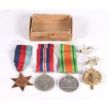 A WWII Auxiliary Territorial Service ATS medal trio with cap and collar badges and posting box