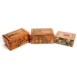 Three Japanese Himitsu Bako puzzle boxes with inlaid parquetry decoration, the largest 15cm wide (