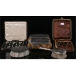 A cased set of silver teaspoons, Birmingham 1938, a pair of silver backed brushes, and other items.