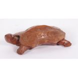 A Chinese carved wooden figure of a turtle, 16cm by 8.5cm.