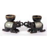 A pair of Chinese ceramic salts in the form of kneeling elephants, 10cm high.