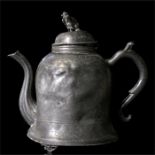 A Chinese pewter Swatow teapot, decorated with fish and figures with fo dog finial, 21cm high.