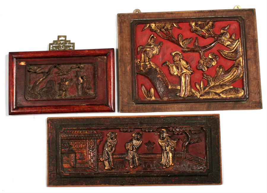 Three Chinese carved wooden and gilded figural plaques, 34cm by 25cm, 42cm by 17cm and 22cm by