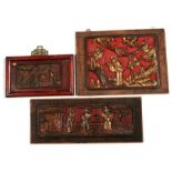 Three Chinese carved wooden and gilded figural plaques, 34cm by 25cm, 42cm by 17cm and 22cm by