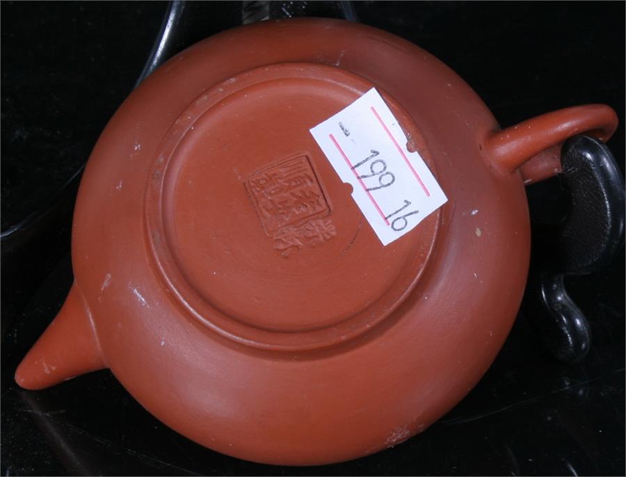 A Chinese Yixing pottery teapot with impressed mark to base, 5.5cm high. - Image 3 of 3