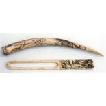 A Chinese ivory paper knife with carved handle, 22cm long; and a Balinese antler tip carved with a