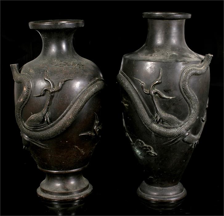 Two Japanese bronze vases decorated in relief with a coiled dragon (dragon heads missing) 36cm and