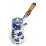 An early 20th century Japanese Arita blue & white chocolate pot, decorated with flowers, 15cm high.