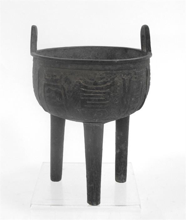 A Chinese bronze tripod censer, possibly Ming Dynasty (one leg replaced), 16cm high.