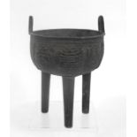 A Chinese bronze tripod censer, possibly Ming Dynasty (one leg replaced), 16cm high.