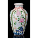 A 19th century Japanese vase decorated with flowers in enamel colours, two character mark to base,