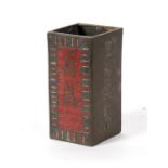 A Chinese Cloisonne brush pot of rectangular form, decorated with calligraphy on a red ground,