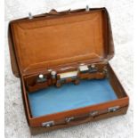 A Goldsmiths and Silversmiths Company gentleman's fitted leather travelling case with canvas outer