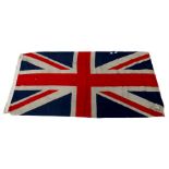 A Union Jack flag 65cm x 138cm Condition Report moth damage, holes and tears