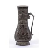 A Chinese bronze applique in the form of a vase, with museum number to verso, 17cm high.