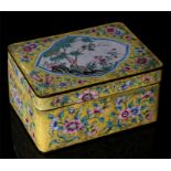 A Chinese yellow ground enamel lidded box decorated with flowers and birds in a tree, 15cm by