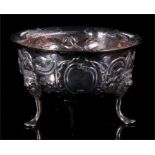 An early 18th century Irish silver sugar bowl of circular fluted form on three lion mask capped