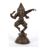 A 19th century Indian bronze figure of Ganesh standing on a lotus base, 21cm high.