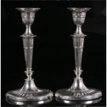 A pair of Victorian silver candlesticks with tapering column on shaped weighted base, Sheffield
