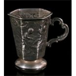 A Continental silver miniature cup of tapering hexagonal form, decorated in relief with children 4.