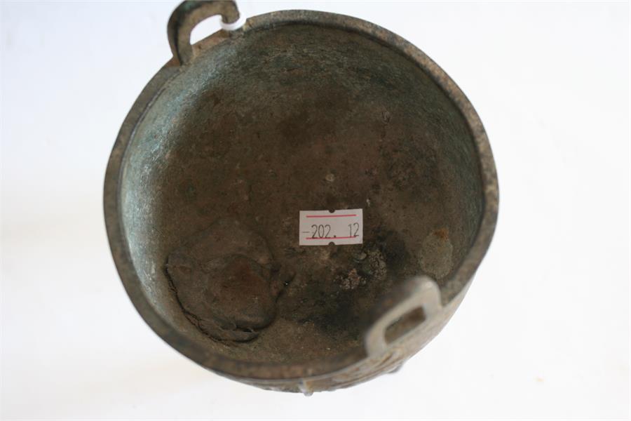 A Chinese bronze tripod censer, possibly Ming Dynasty (one leg replaced), 16cm high. - Image 5 of 8