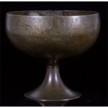 A 12th century Persian Khorassan bronze footed bowl, engraved to the rim with Kurfic Scrip in