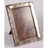 A sliver strut photograph frame, dated Birmingham 1918, 17.5cms high.