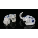 A pair of Japanese Hirado kimono hooks in the form of dogs.
