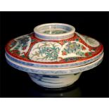 A Chinese lidded bowl, decorated flowers and foliage in enamel colours 26cm diameter