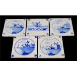 Five 18th century Delft tiles, each decorated with buildings and boats by the shore, 13cm x 13cm.