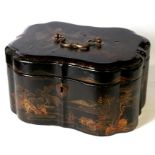 An 18th century Chinoiserie black lacquer tea caddy, decorated with buildings within a mountainous