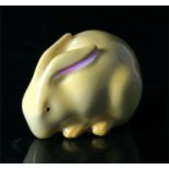 A Royal Worcester yellow glazed miniature figure of a rabbit, with green mark to underside, 5cm