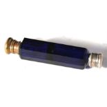 A faceted blue glass double-ended scent bottle, 13cm long.