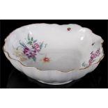 A Meissen shell shaped bowl, decorated with flowers and insects, 25cm diameter. Condition Report